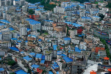 are people in china putting blue tarps on their roofs